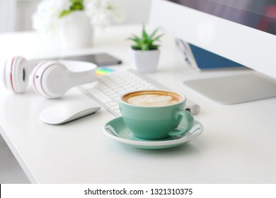 Work space has a cup of coffee in the morning. On the desk - Powered by Shutterstock