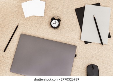 Work space and time management concept. Start of freelancers working day. Work from home under quarantine. Laptop and time monitoring, nine clock in morning. 