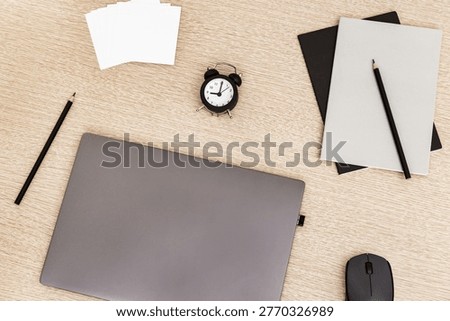 Work space and time management concept. Start of freelancers working day. Work from home under quarantine. Laptop and time monitoring, nine clock in morning. 