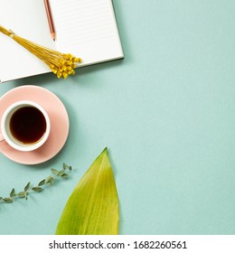 Work And Study Place. Note Book, Cup Of Coffee With Floral Decoration. Flat Lay, Top View, Copy Space