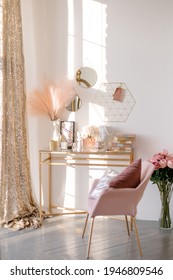 Work table in a bright room. Feminine space stylish interior. Boudoir makeup table. Delicate tones.