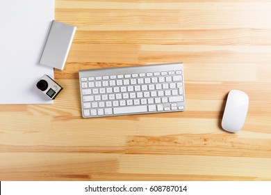 Work Table Keyboard, Action Camera, Power Bank And Mouse Top View