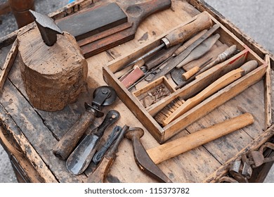 Work Table With Old Tools Of The Artisan Shoemaker