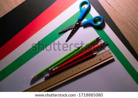 Work table, ruler, pencils, scissors, cardboard