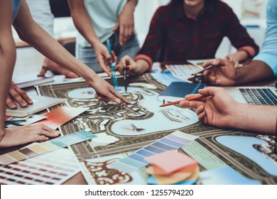 Work. Table. Tam of Young People. Project. Cooperation. Group. Different Nationalities. Generate Idea. Color. Design. Young. Designers. Spend Brainstorming. Teamwork. Large Bright Office. - Powered by Shutterstock