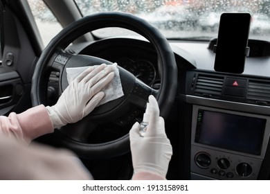 Work As Taxi Driver And Disinfection During Covid Quarantine. Millennial African American Female In Protective Gloves With Sanitizer Disinfects Steering Wheel With Napkin, Cropped, Empty Space