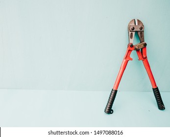work tool, blue background, bolt cutter, red and blue. working.