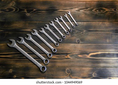 Work tool. Set of keys on a wooden background.