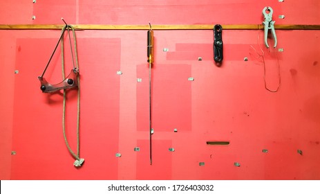 Work tools on the board and in the workshop. Workshop scene. A lot of old tools on a dirty desktop. The concept of carpentry and painting.