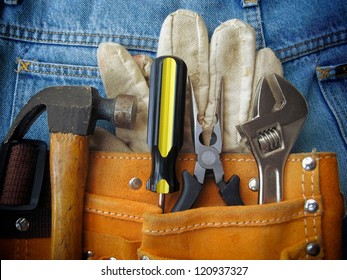 Work tools in orange tool bag with jeans. - Powered by Shutterstock