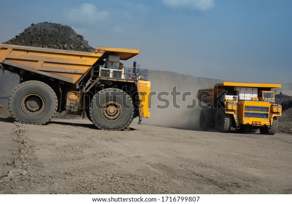work of trucks at a coal\
mine
