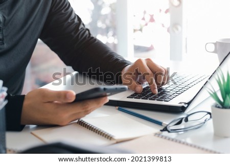 Work using mobile phone typing computer mobile chat laptop contact us at workplaces, planning ideas investors internet searching, ideas connecting people.