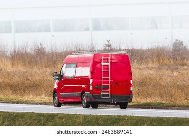 Work van equipped with tools and ladder in transit
