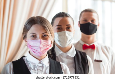 Work Of A Waiter In A Restaurant In A Medical Mask