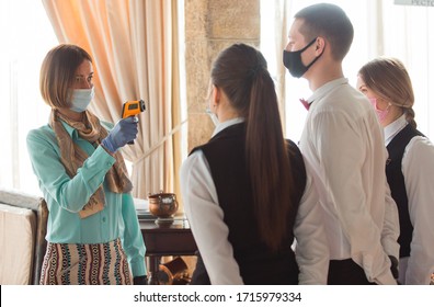 Work Of A Waiter In A Restaurant In A Medical Mask