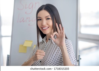 At Work. Young Sign Language Interpreter Working And Smiling