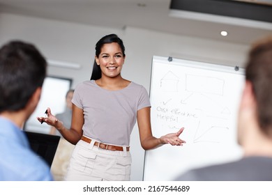 Workable Are Her Speciality. A Young Businesswoman Facilitating A Budget Meeting In The Boardroom.