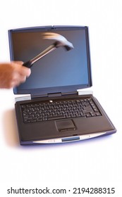 Workaholic. Man Destroying A Computer With A Hammer. Isolated 