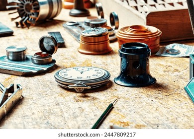workbench cluttered with horological instruments and parts narrates a story of meticulous craftsmanship