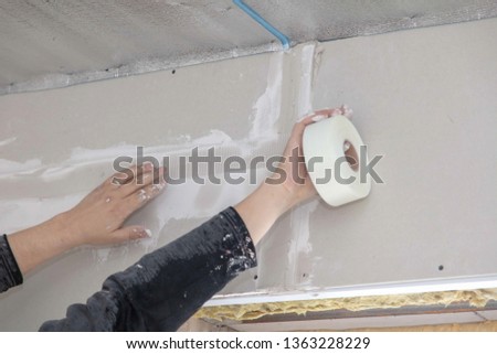 Worker Aligns Walls Plaster Repair House Stock Photo Edit