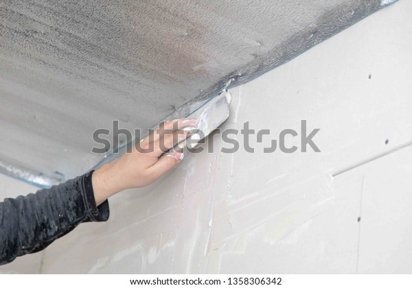 Worker Aligns Walls Plaster Repair House Stock Photo Edit