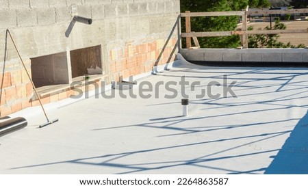 Worker applies pvc membrane roller on roof very carefully. Correct welding with hand-welder, corner.