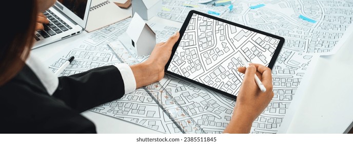 Worker, architect and engineer work on real estate construction project oratory planning with cartography and cadastral map of urban town area to guide to construction developer business plan of city
