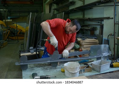 Worker Assembling Fuselage Of A Light Passenger Plane At The Assembly Hall. February 11, 2020. Kiev, Ukraine