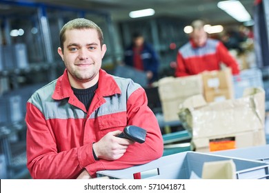 Worker With Barcode Scanner At Warehouse