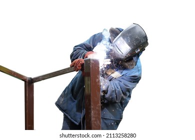 A Worker In Blue Overalls And A Protective Mask Connects Metal Elements By Electric Welding. Sparks Fly. Isolated On White Background.                          