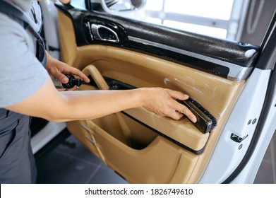 Worker With Brush Wipes Car Door Trim, Detailing