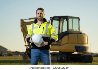 Worker with bulldozer on the building construction.