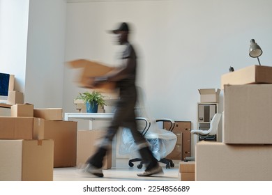 Worker carrying boxes during relocation