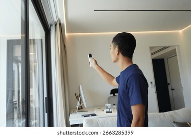Worker checking Automatic curtain control system in apartments
