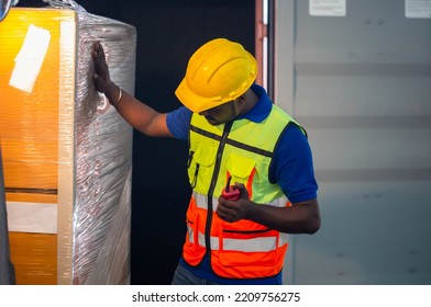 Worker Checking Inventory In Distribution Warehouse, Man Taking Inventory In Factory Warehouse, Warehouse Forklift Loader Works With Goods