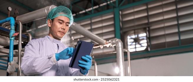 Worker Checking quality or checking stock of glass bottle in beverage factory. Worker QC working in a drink water factory  - Powered by Shutterstock