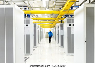 Worker Checking In The Telecommunication Room