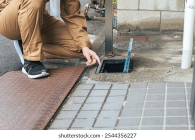 Worker checking the water meter