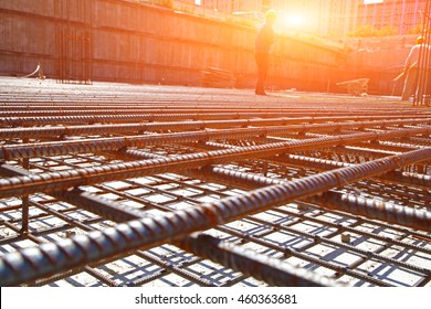 worker in the construction site making reinforcement metal framework for concrete pouring