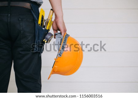 Worker with construction tools.