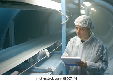 Worker Controls Sugar On Production Line In A Factory