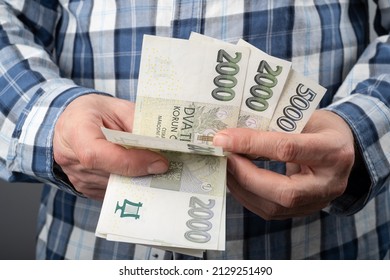 Worker Count Czech Money in cash, Finance in Czechia concept. Czech Koruna 2000 CZK banknotes.