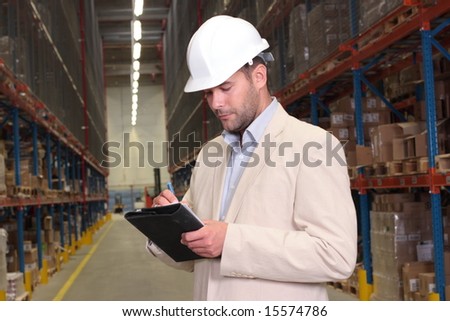 worker counting stocks and making notes