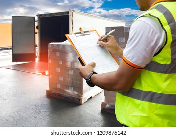 Worker Courier Holding Clipboard Control Loading Package Box into Cargo Container. Trucks Parked Loading at Dock Warehouse. Supply Chain Shipment Boxes. Shipping Warehouse Logistics  Cargo Transport.	 - Shutterstock ID 1209876142
