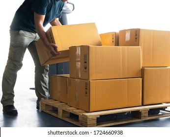 Worker courier lifting boxes stack on pallet, package, cardboard box, warehouse delivery service shipment goods, manufacturing warehouse.