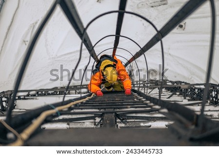 Worker crawling up the stairs