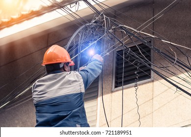 Worker is cutting power cable.The electrician made a bad mistake and was electrocuted.Electrical system development.