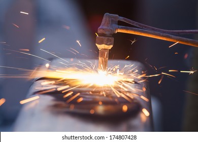 Worker Cutting Steel Pipe Using Metal Torch And Install Roadside Fence