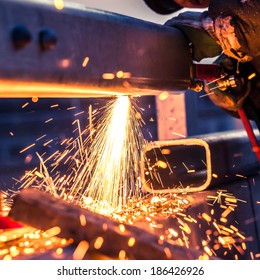 Worker Cutting Steel Pipe Using Metal Torch And Install Roadside Fence