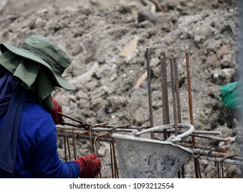 Worker Is Cutting Steelbar At Worksite